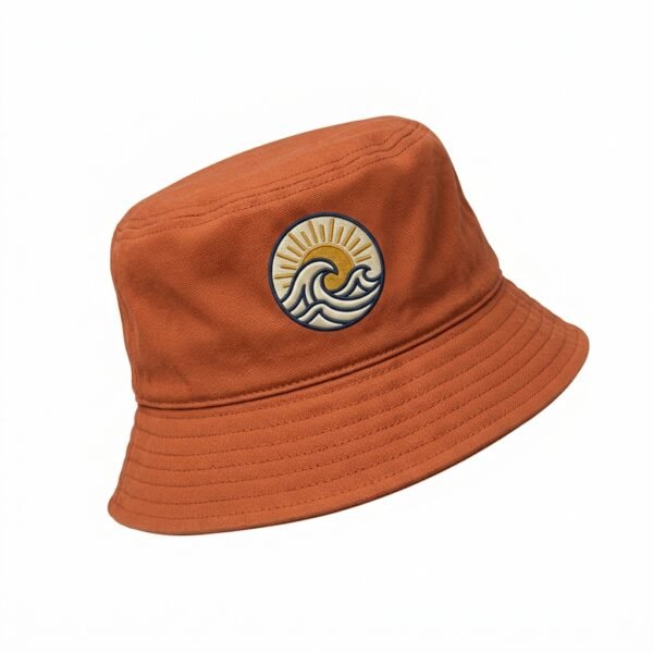 Custom Rust Orange Bucket Hat – Wave Badge Embroidery Rust orange bucket hat with embroidered wave badge