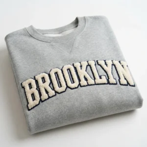 Grey crewneck with chenille lettering