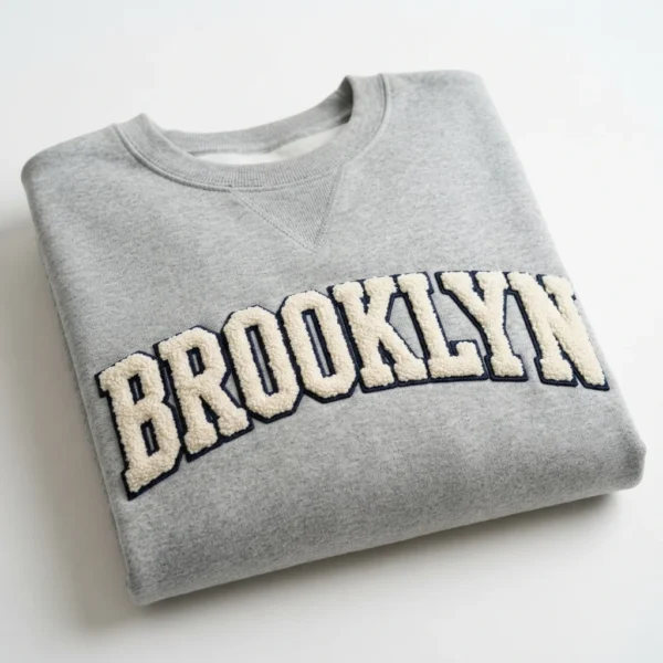Custom Crewneck Sweatshirt – Grey Chenille City Lettering Grey crewneck with chenille lettering