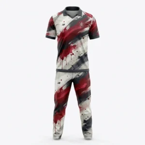 White cricket uniform with red and black brush stroke print