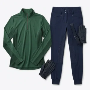 Green quarter zip base layer with navy riding breeches and gloves