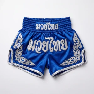 Custom Muay Thai Shorts – Royal Blue & Silver Thai Script Royal blue Muay Thai shorts with silver Thai script
