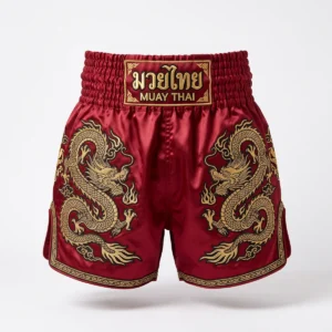 Red Muay Thai shorts with gold dragon embroidery
