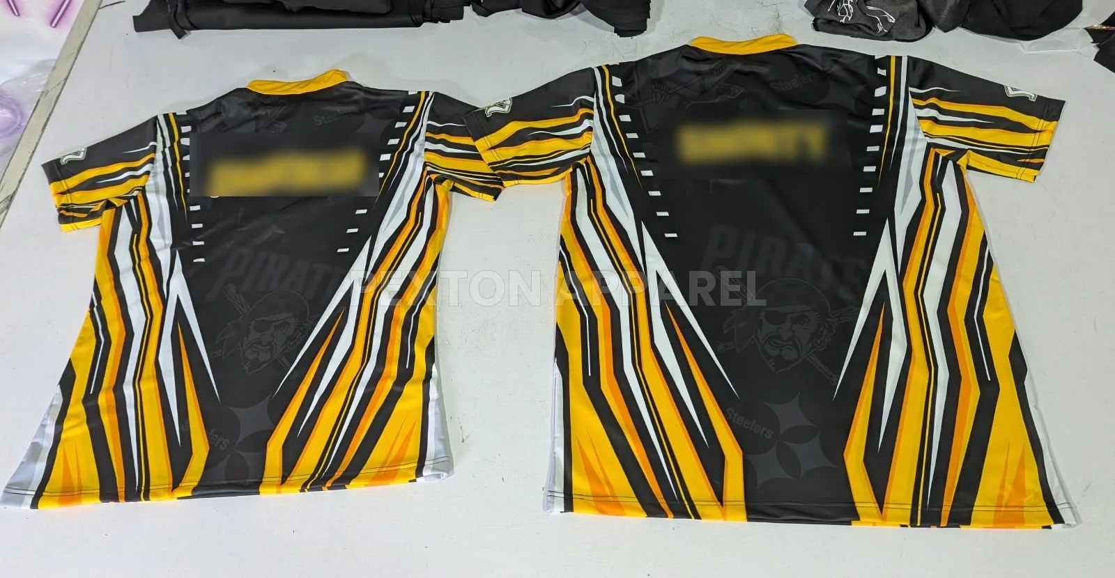 Custom sublimated dart jerseys with player names made by Pexton Apparel