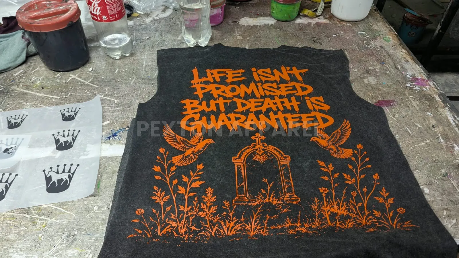 Screen-printed graphic on a black tank top at Pexton Apparel
