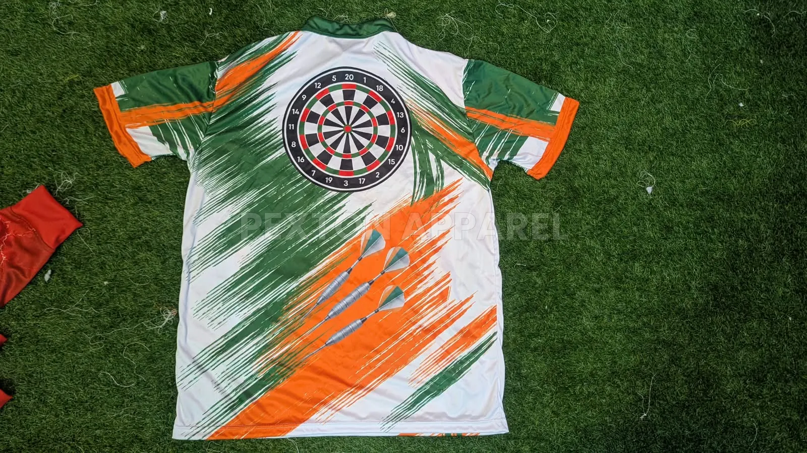 Sublimated dart shirt in green, white and orange made by Pexton Apparel